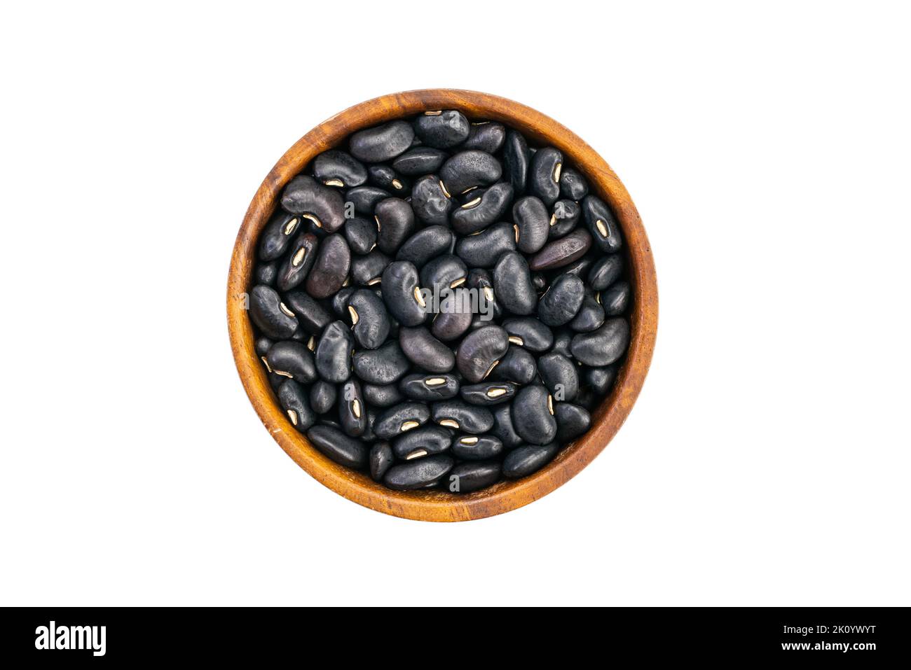 Top view or flat lay of fresh raw black bean in wooden bowl isolated on white background with clipping path. Stock Photo