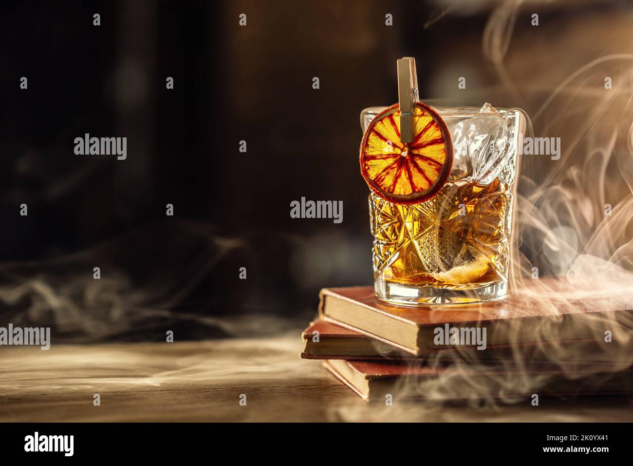 Glass cup with Old Fashioned cocktail in retro style. Stock Photo