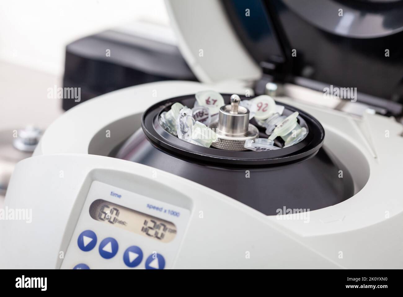 Table centrifuge filled with tubes. Spin columnbased nucleic acid