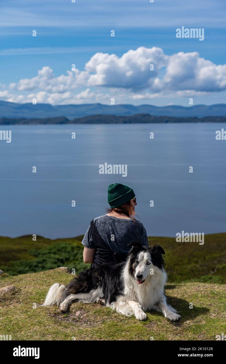girl and pet border collie dog at applecross bay, scotland, uk Stock Photo