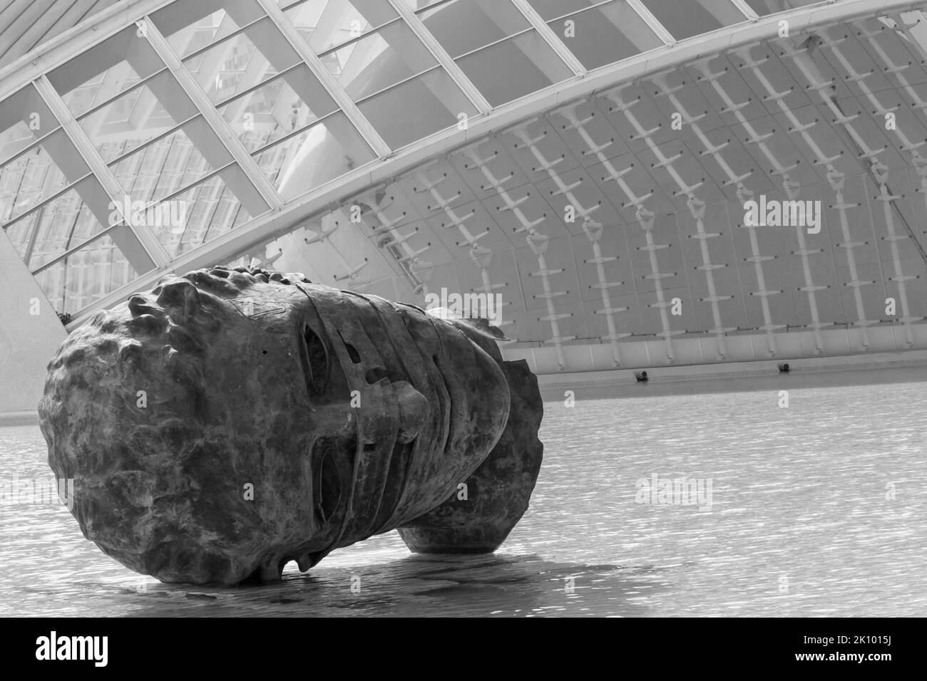Face head sculpture by Igor Mitoraj in front of Hemisfèric building