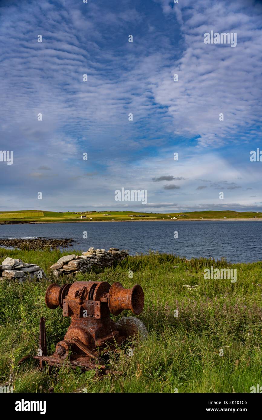 rusting farm machinary on cliffs at skara brae, orkney, scotland, uk Stock Photo Alamy