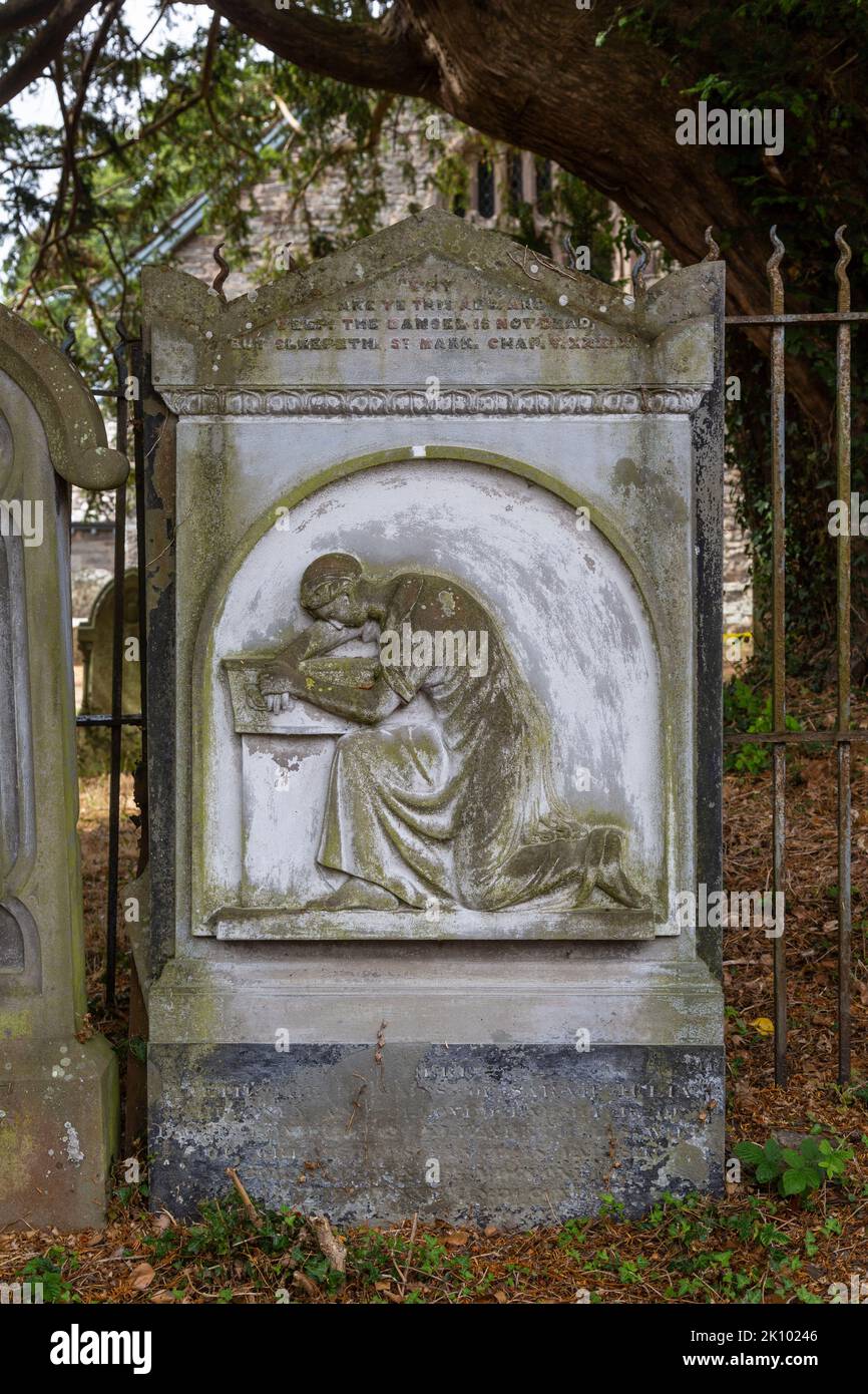 Old headstone in the churchyard of St Stephen's Church, Llanstephan, Powys, Wales Stock Photo