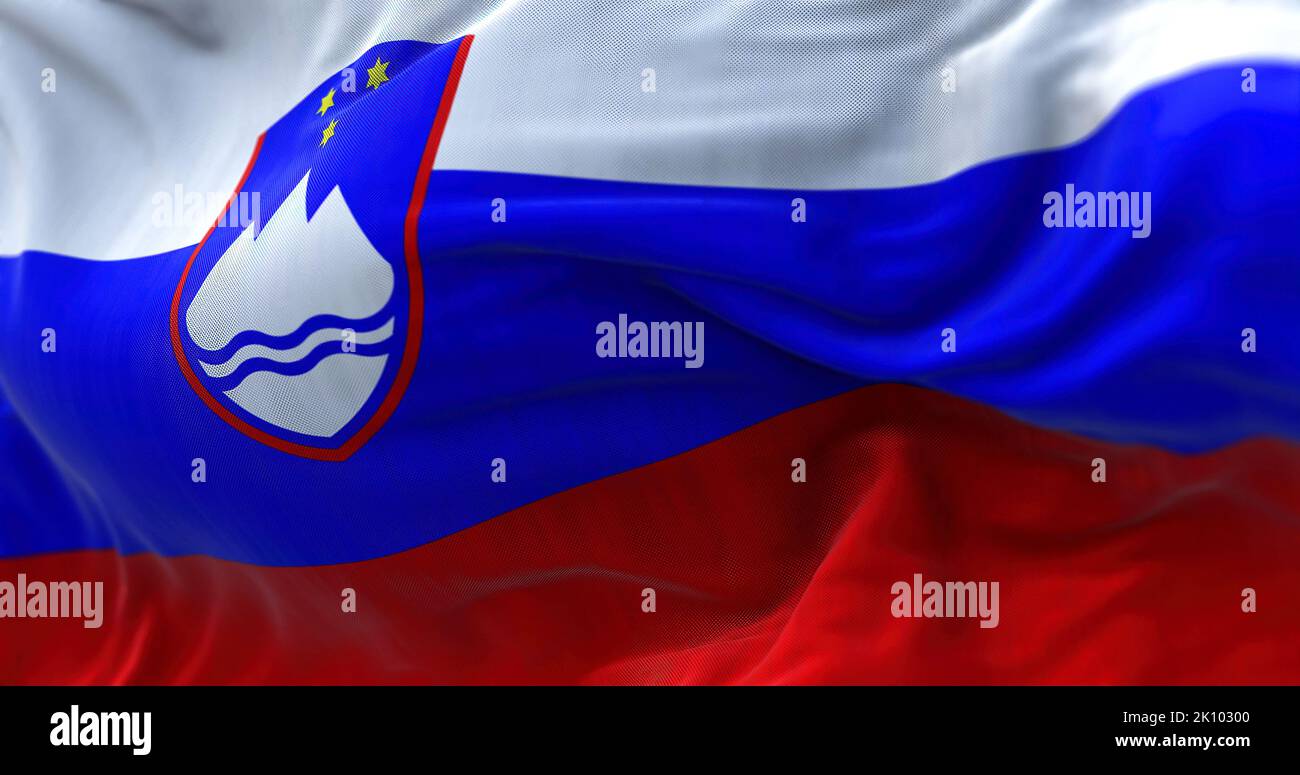 Close-up view of the Slovenia national flag waving in the wind. Slovenia is a country in Central Europe. Fabric textured background. Selective focus Stock Photo