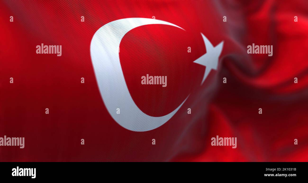Close-up view of the Turkey national flag waving in the wind. Turkey is a transcontinental country located mainly in Western Asia. Fabric textured bac Stock Photo
