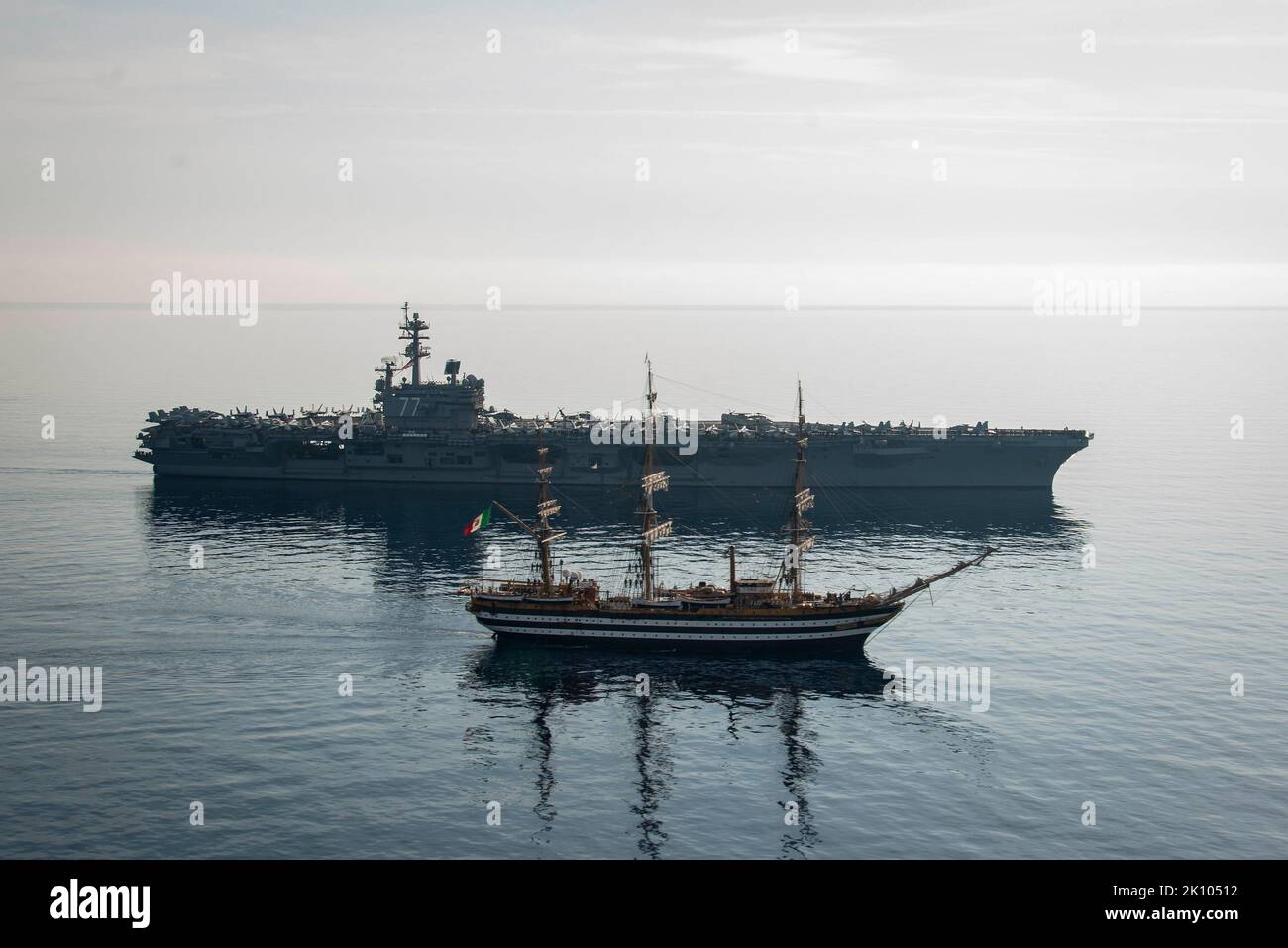 USS George Bush, Italy. 01 September, 2022. The Italian tall sail training ship ITS Amerigo Vespucci sails alongside the U.S. Navy Nimitz-class aircraft carrier USS George H. W. Bush during a transit off the coast of Italy, September 1, 2021 in the Adriatic Sea. The ships operated together to commemorate the 60th anniversary of a 1962 meeting between USS Independence and the Italian senior national vessel Amerigo Vespucci.  Credit: MC2 Stuart Posada/Planetpix/Alamy Live News Stock Photo