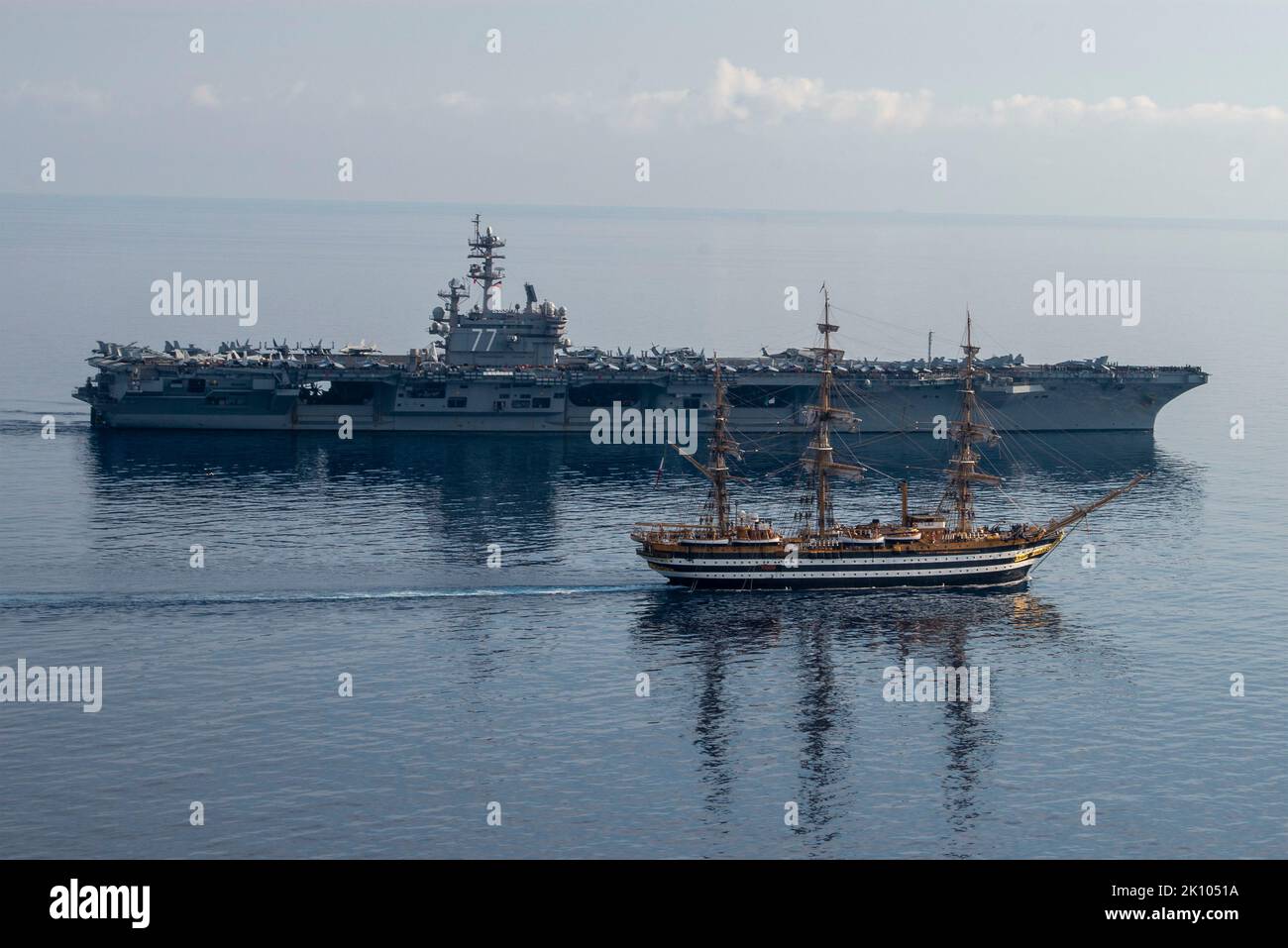 USS George Bush, Italy. 01 September, 2022. The Italian tall sail training ship ITS Amerigo Vespucci sails alongside the U.S. Navy Nimitz-class aircraft carrier USS George H. W. Bush during a transit off the coast of Italy, September 1, 2021 in the Adriatic Sea. The ships operated together to commemorate the 60th anniversary of a 1962 meeting between USS Independence and the Italian senior national vessel Amerigo Vespucci.  Credit: MC2 Stuart Posada/Planetpix/Alamy Live News Stock Photo