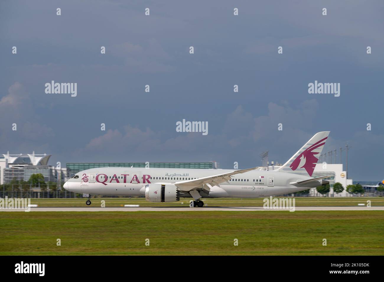 Munich, Germany - August 26. 2022 : Qatar Airways Boeing 787-8 Dreamliner with the aircraft registration A7-BDA is landing on the southern runway 26L Stock Photo
