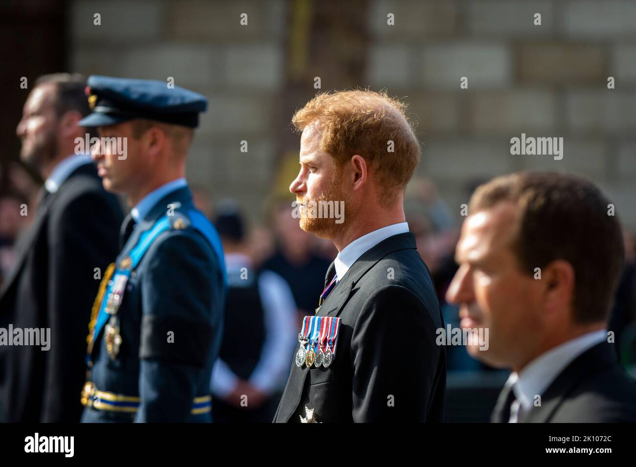 London, UK.  14 September 2022. Prince William, Prince Harry and Peter Phillips follow the late Queen’s coffin carried on a gun carriage in Whitehall en route to Westminster Hall where it will lie in state for four days allowing the public to visit to pay their respects, ahead of the state funeral on 19 September.  Queen Elizabeth II, the longest-reigning monarch in British history, died at the age of 96 in Balmoral, Scotland and her son, now known as King Charles III, has succeeded her.  Credit: Stephen Chung / Alamy Live News Stock Photo