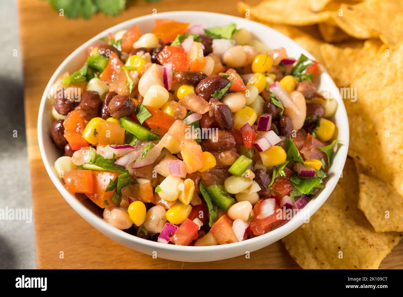 Homemade Organic Cowboy Caviar Dip with Corn Beans and Chips Stock Photo