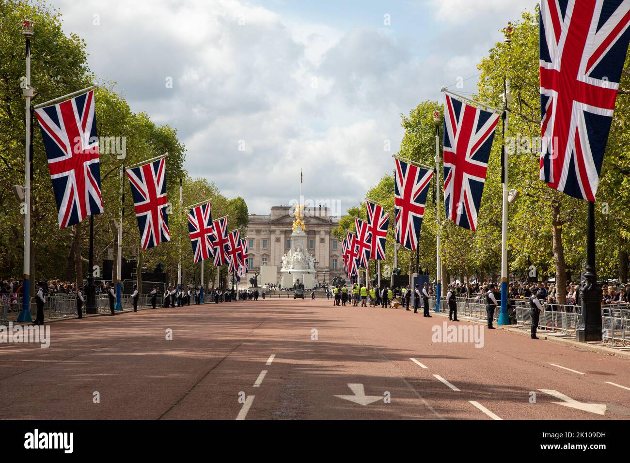 London, England. 14th September, 2022. The Mall is decorated with flags as mourners line the street to pay their respects to the Queen as she makes her final journey to Westminster Hall where she will be lying in state until the day of her funeral. Credit: Kiki Streitberger / Alamy Live News Stock Photo