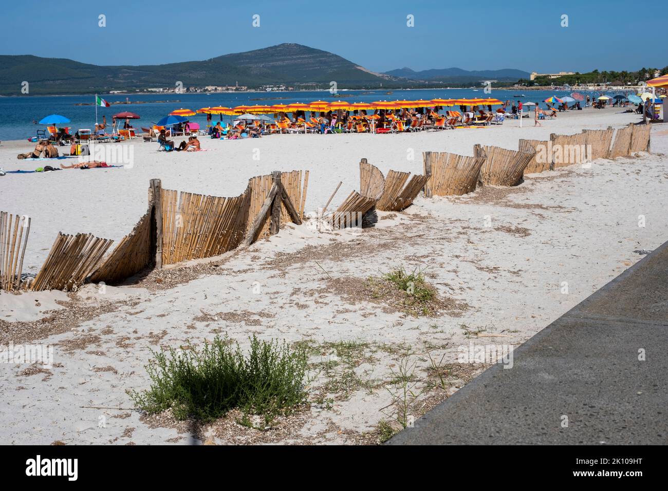 View of the Spiaggia del Lido di Alghero beach near the old town of ...