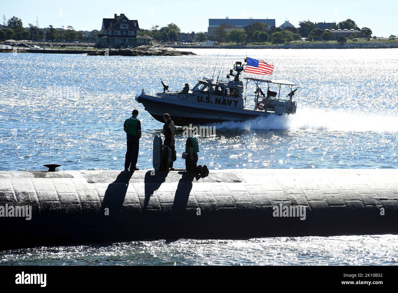 Groton, United States. 02 September, 2022. A U.S. Navy patrol boat escorts the nuclear-power Los Angeles-class fast attack submarine USS San Juan along the Thames River as it arrives to homeport at Naval Submarine Base New London, September 2, 2022 in Groton, Connecticut. Credit: MCS Joshua Karsten/U.S. Marines/Alamy Live News Stock Photo
