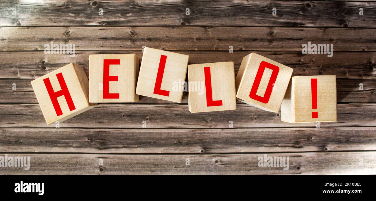Word Hello from wooden letters on wooden background Stock Photo