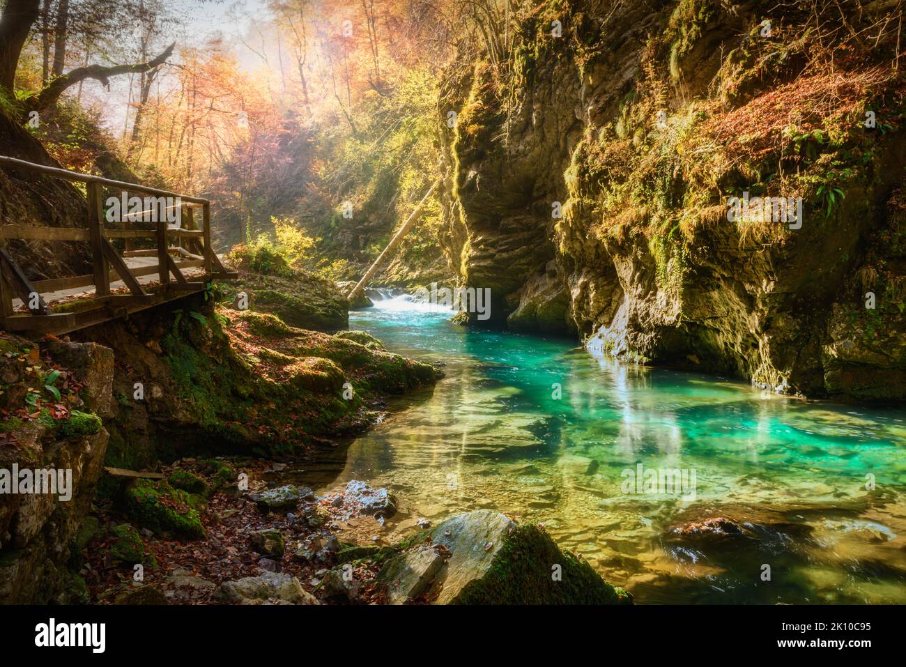 Famous and beloved canyon of Vintgar Gorge with wooden path in beautiful autumn colors near Lake Bled of Triglav National Park in Slovenia Stock Photo