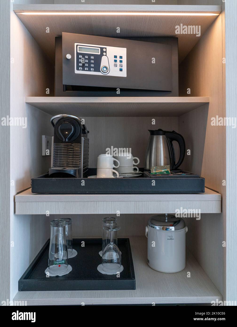 Hotel safe, in a hotel room, coffee machine, glasses, cups, as a