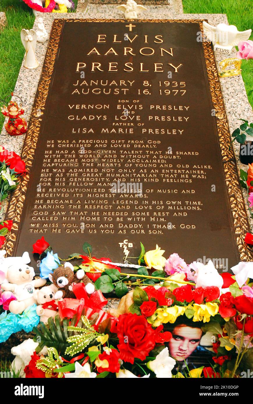 The Grave of rock n roll singer and entertainer Elvis Presley, is surrounded by offerings and gifts on his estate in Graceland, Memphis, Tennessee Stock Photo