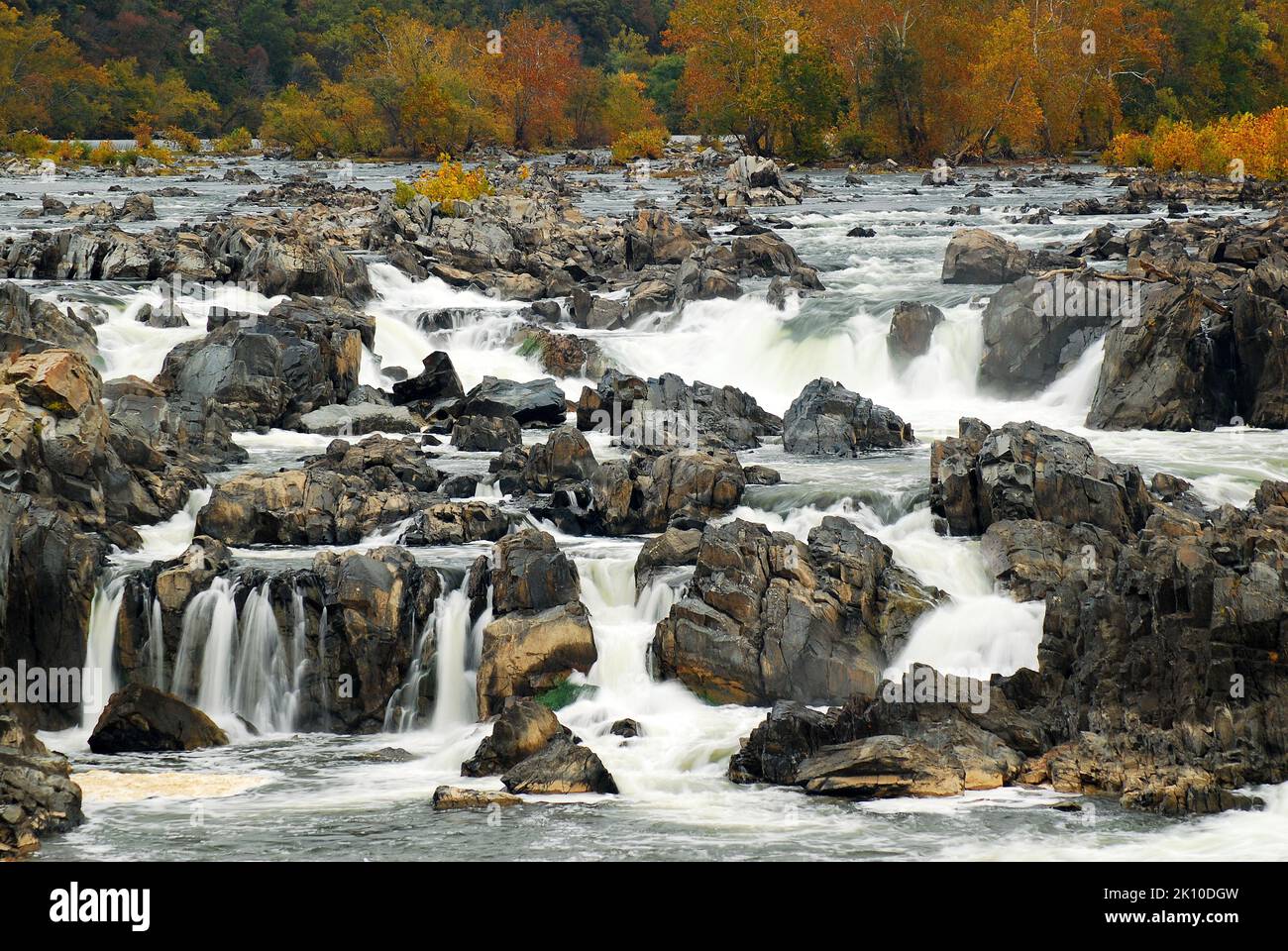 Water cascades over the rocks at the Great Falls of the Potomac waterfall set in a park in Virginia, outside of Washington, DC Stock Photo