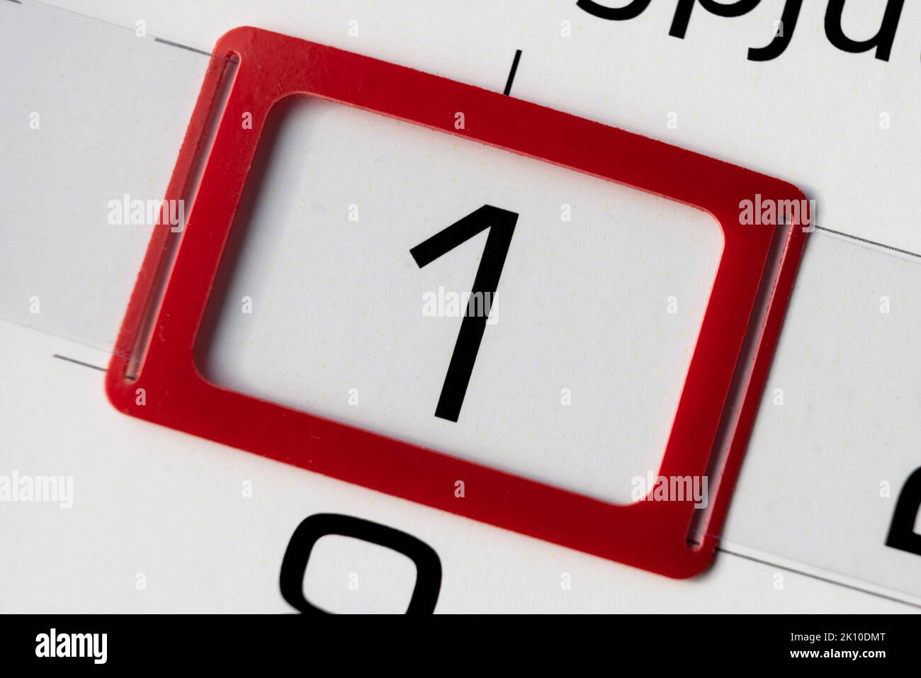 Red mark on a calendar sheet. First day of the month Stock Photo