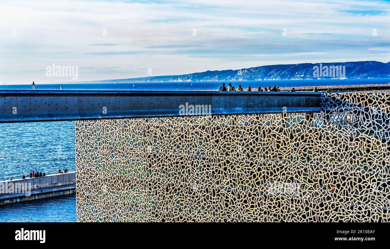 Mucem Museum Tourists Harbor Sailboats Mediterranean Sea Marseille Cityscape Breakwater Cote d'Azur France Mucem is museum of European and Mediterrane Stock Photo