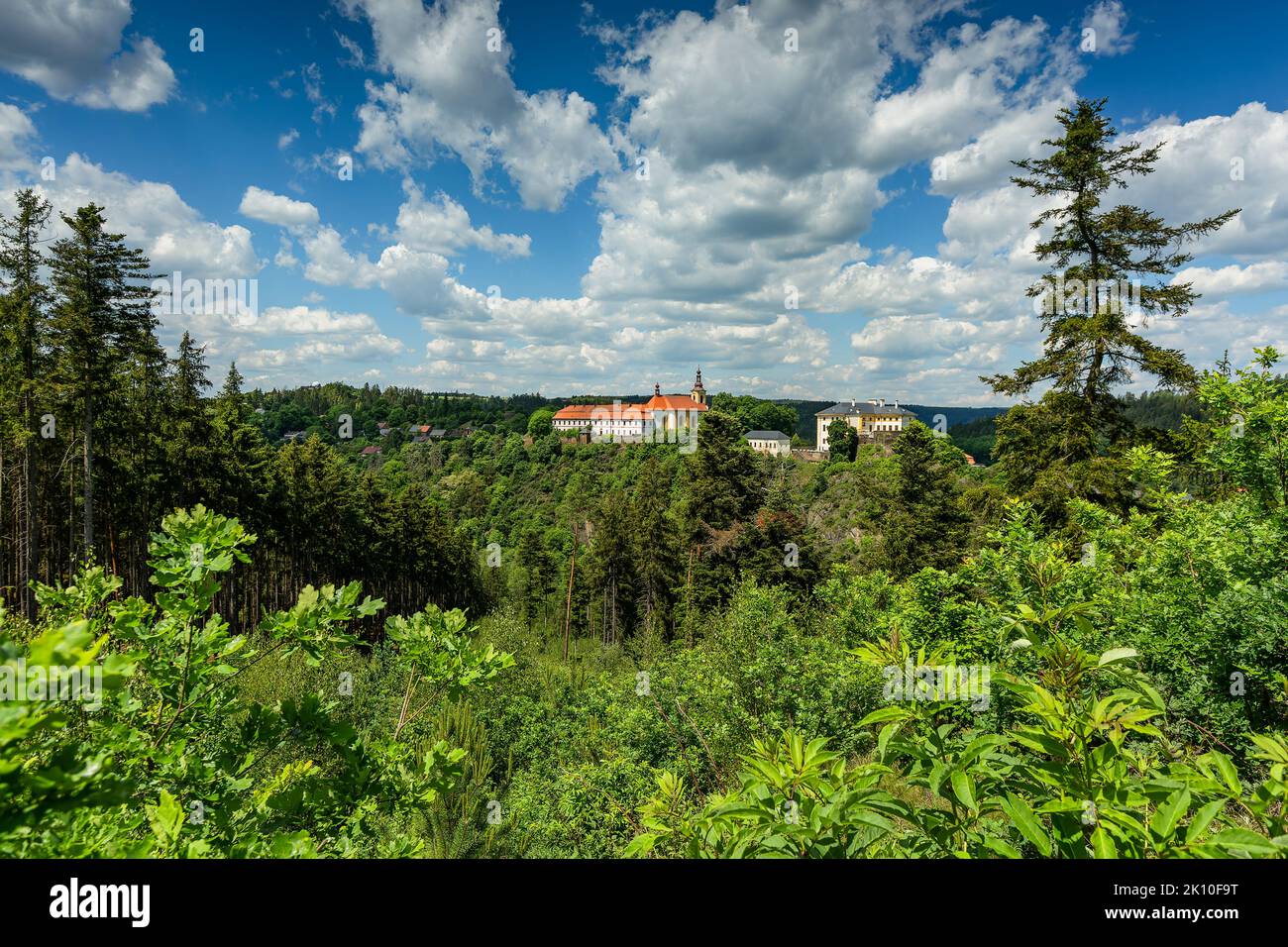 Rabstejn nad Strelou, Czech Republic - June 12 2022: Distant view of the building of former monastery of Servites, the Virgin Mary church and the cast Stock Photo