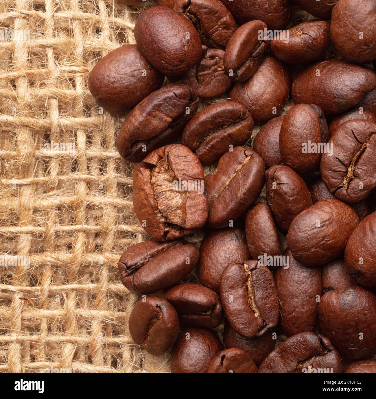 Coffee beans close-up on burlap Stock Photo