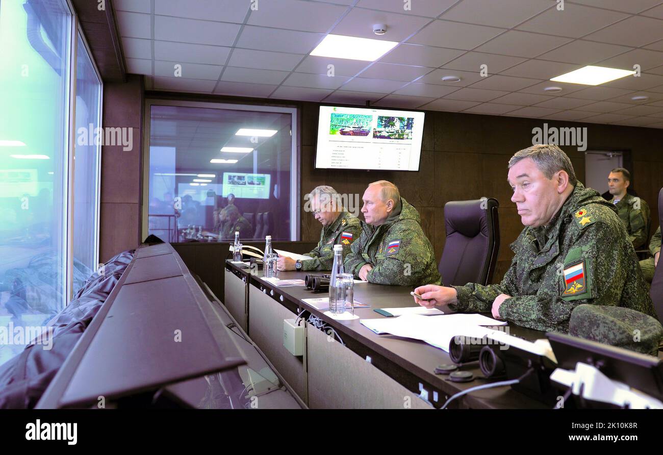 Vladimir Putin - Vostok 2022 Command Post Exercise - Vladimir Putin, together with Defence Minister Sergei Shoigu, left, and Chief of the General Staff of the Russian Armed Forces and First Deputy Defence Minister Valery Gerasimov, observed the main stage of the Vostok-2022 strategic command post exercise at the Sergeyevsky range in the Primorye Territory. Stock Photo
