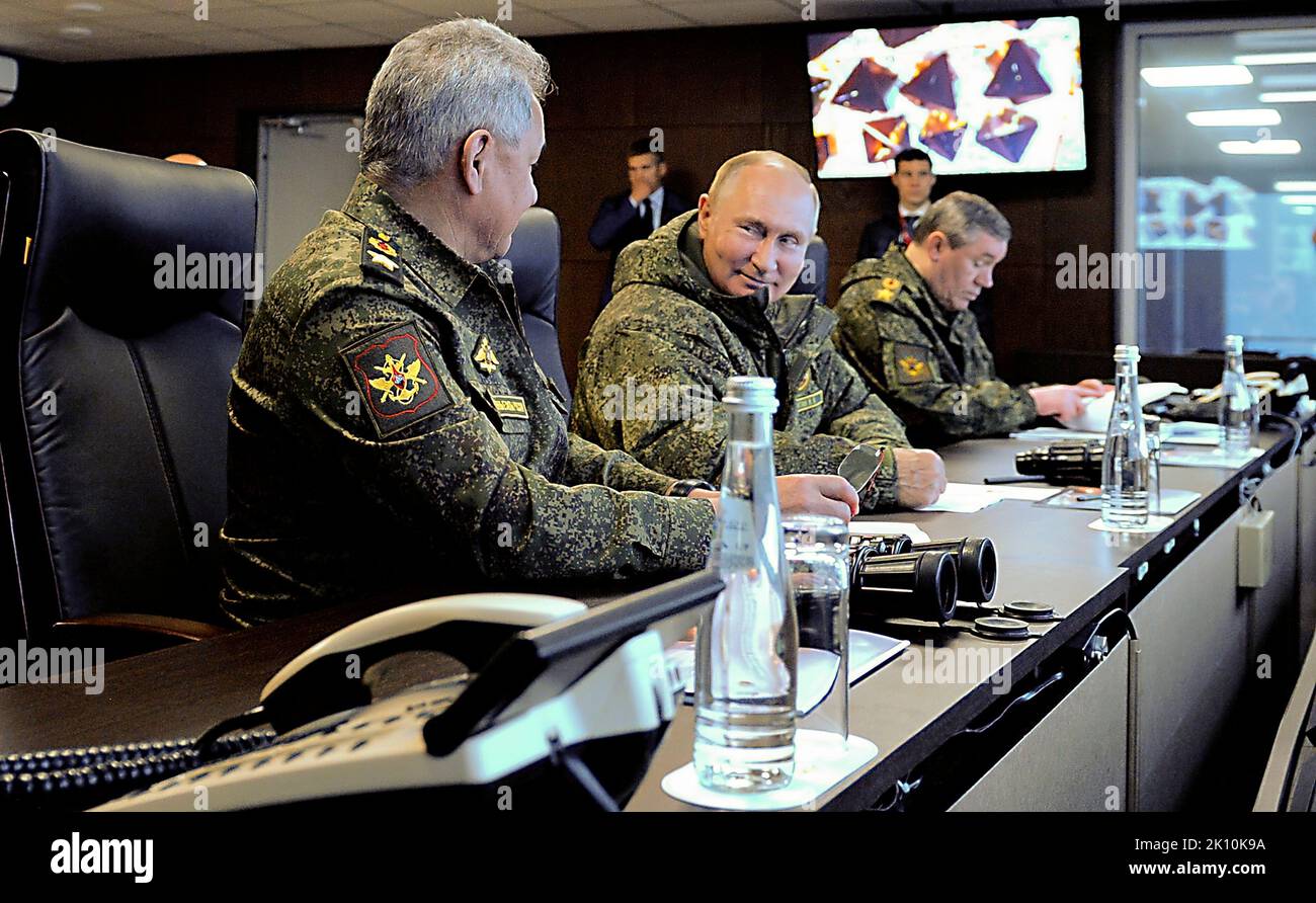 Vladimir Putin - Vostok 2022 Command Post Exercise - Vladimir Putin, together with Defence Minister Sergei Shoigu, left, and Chief of the General Staff of the Russian Armed Forces and First Deputy Defence Minister Valery Gerasimov, observed the main stage of the Vostok-2022 strategic command post exercise at the Sergeyevsky range in the Primorye Territory. Stock Photo