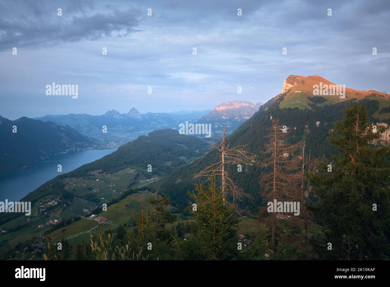 Beautiful summer view of Lake Lucerne (Vierwaldstattersee) and the mountain peaks illuminated by the rising sun. Swiss Alps, Switzerland  Stock Photo