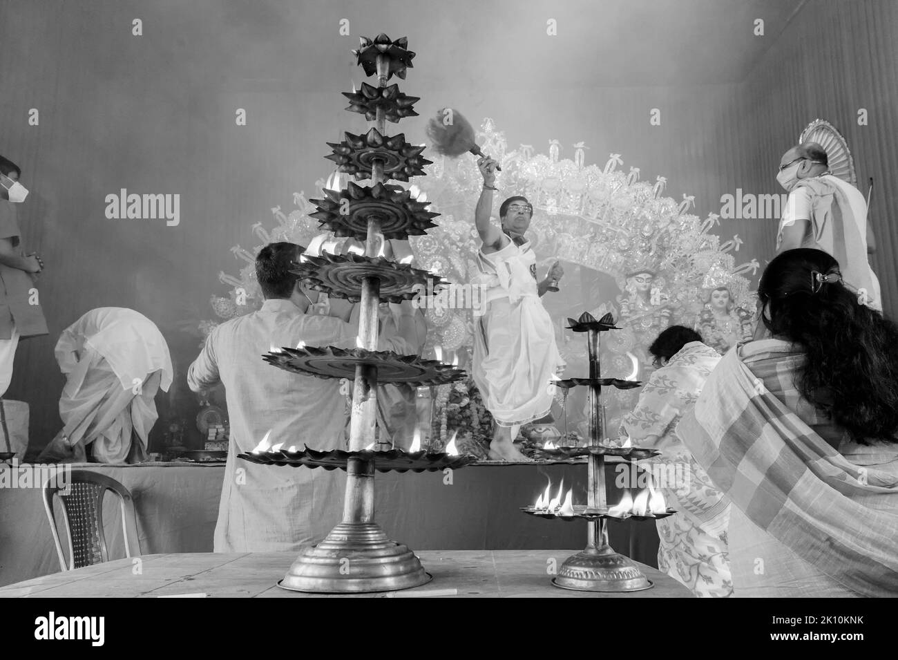 Howrah, West Bengal, India - 25th October 2020 : Goddess Durga is being worshipped by Hindu priest with holy panchapradip during sondhipujo aarti with Stock Photo