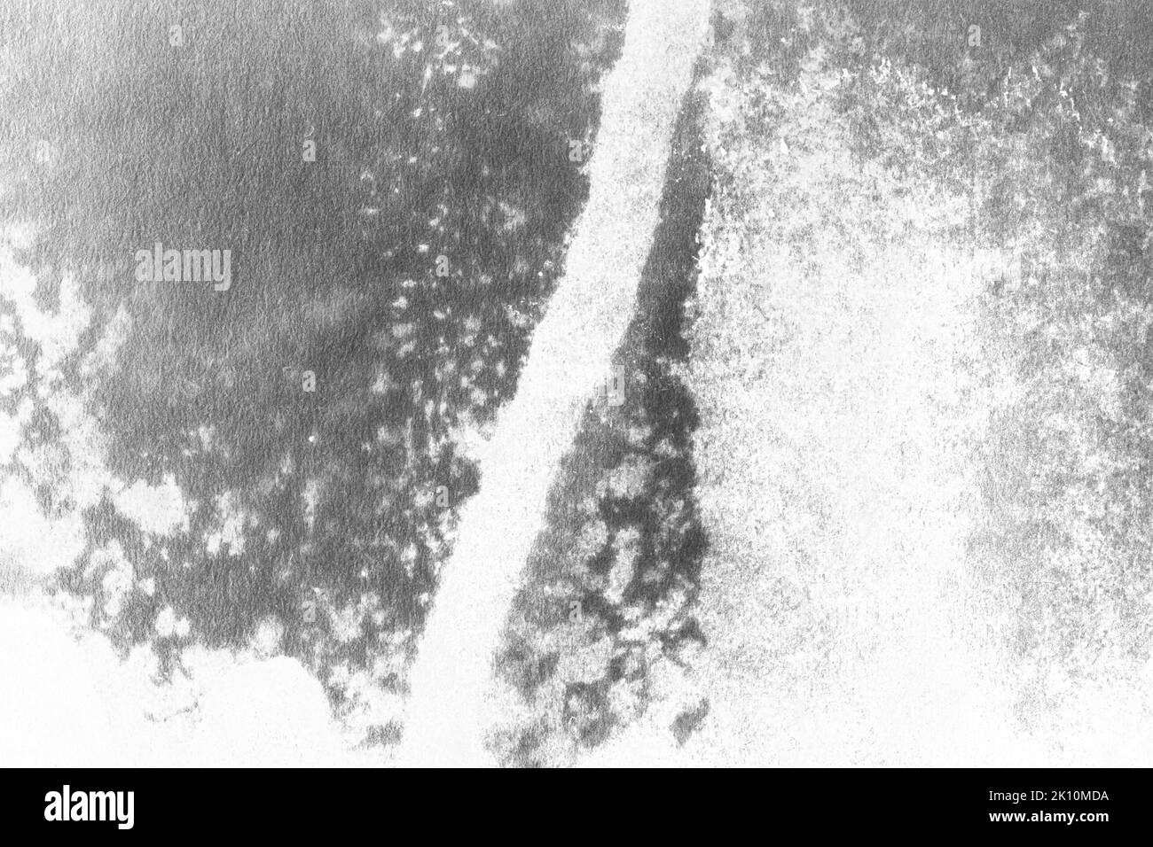black and white texture of old paper with water stains as a background ...