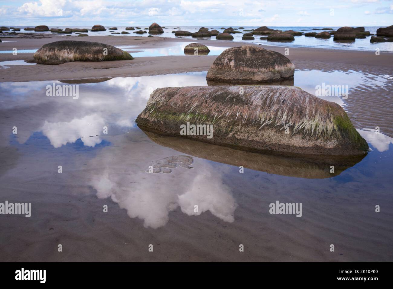 Seaside rocks and shallow waters in Kaltene, Latvia Stock Photo