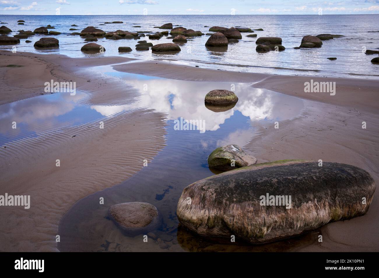 Seaside rocks and shallow waters in Kaltene, Latvia Stock Photo