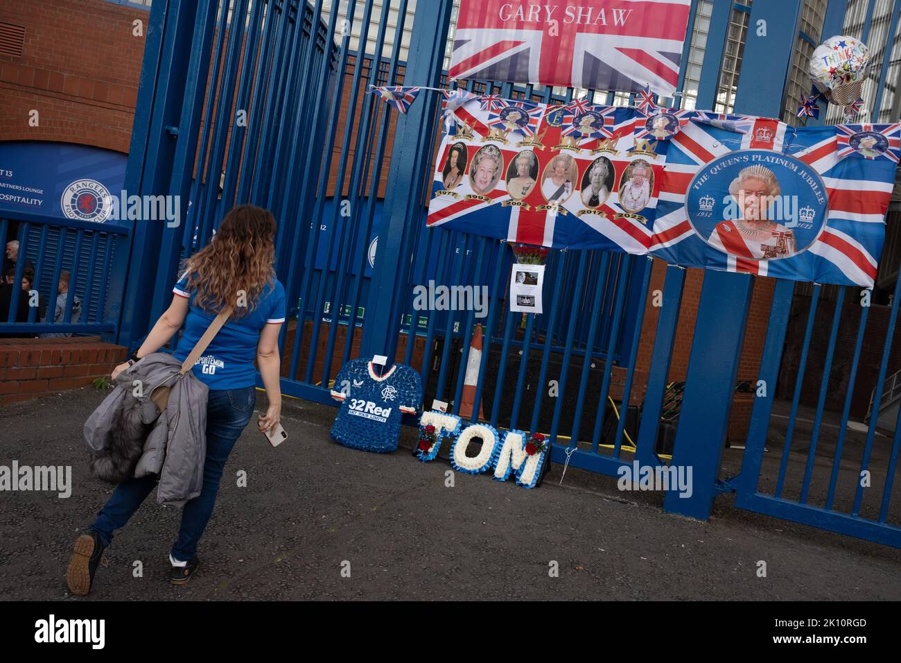 Glasgow, Scotland, 14 September 2022 Flags as marks of respect to Her Majesty Queen Elizabeth II who has died aged 96yrs, on the gates of Rangers FC’s Ibrox Stadium, in Glasgow, Scotland, 14 September 2022. Photo credit: Jeremy Sutton-Hibbert/Alamy Live News. Stock Photo