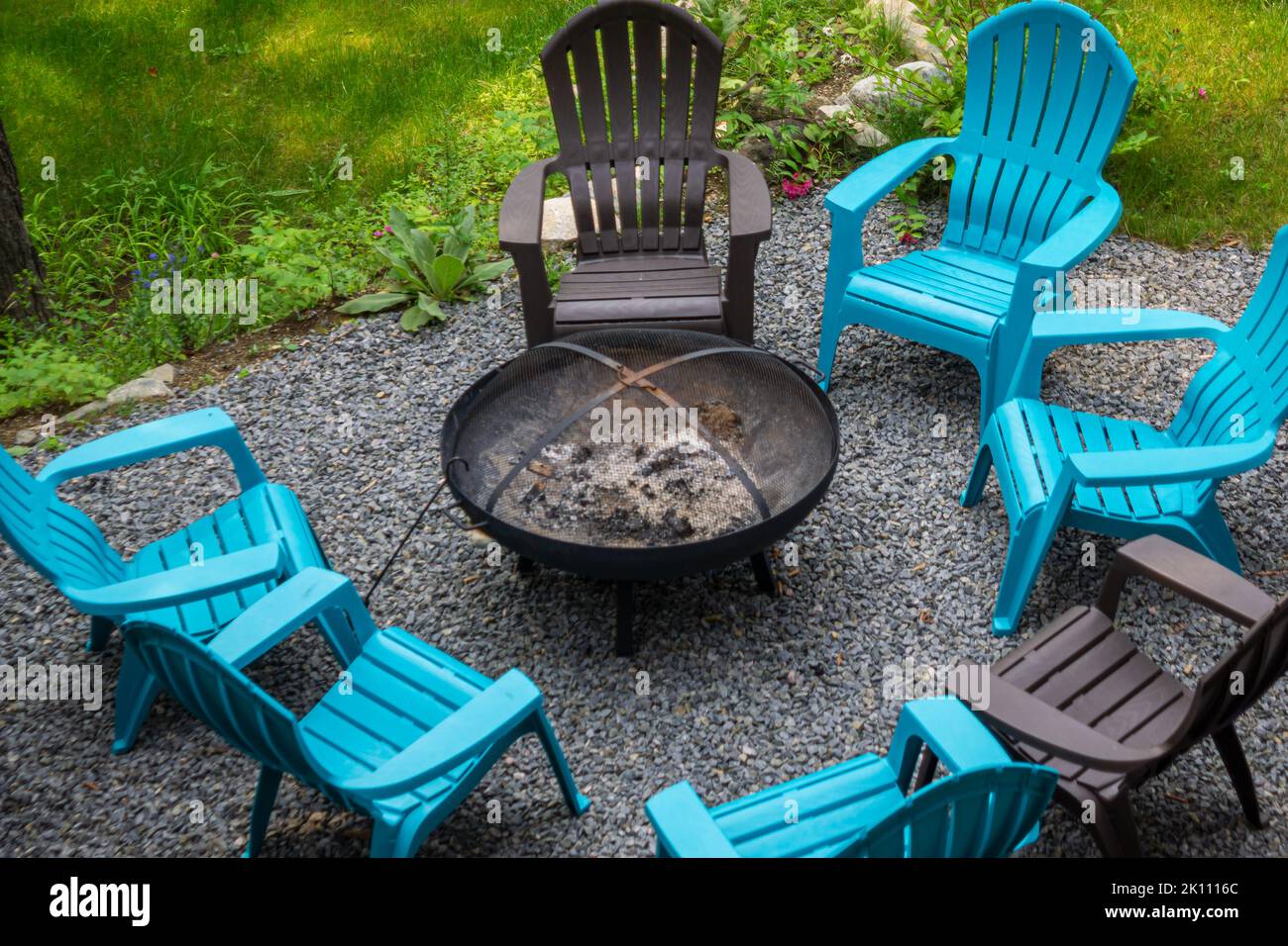 Empty chairs around bonfire in hi res stock photography and images