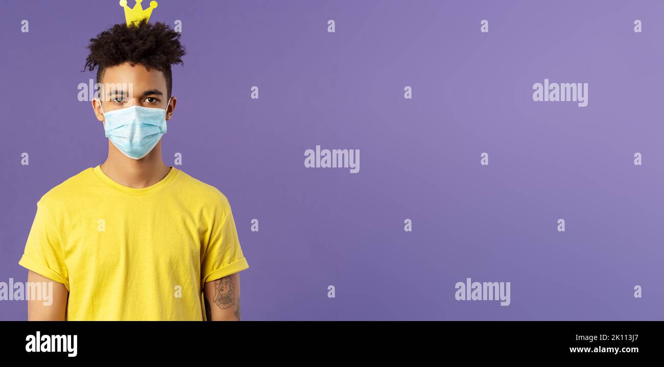 Portrait of funny hispanic guy in face mask, fool around, going crazy