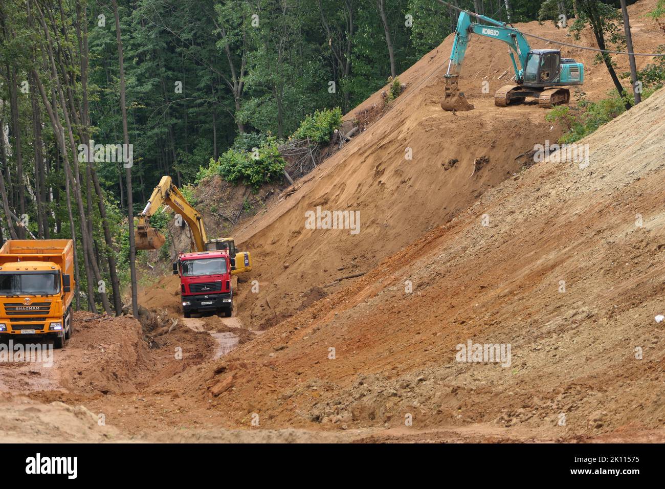 Nizhny Novgorod, Russia, natural monument Raspberry Ridge 09.10.2022. Road construction, construction site, Trucks take out the soil from the construc Stock Photo