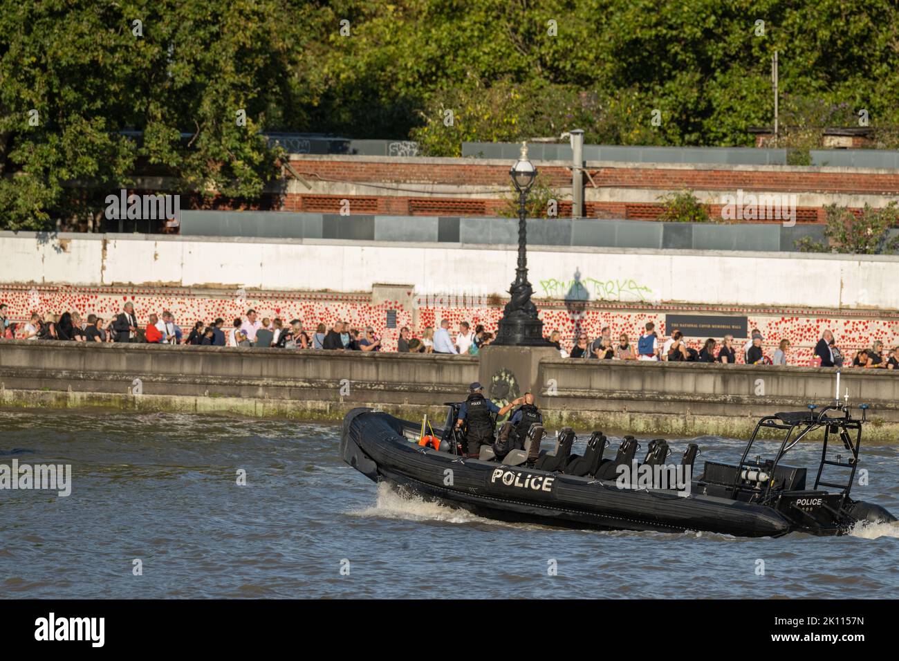 London, UK. 14th Sep, 2022. People queuing on Lambeth bridge to view the coffin of HM The Queen A police RIB (rigid inflatable boat) on the Thames with queue in the background)  Credit: Ian Davidson/Alamy Live News Stock Photo