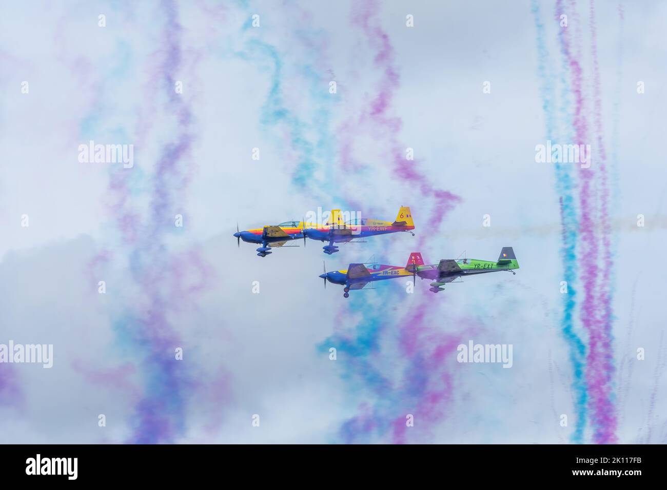 Bucharest, Romania, 4 Sep 2022: Airshow with planes performing acrobatic flight on blue sky, Hawks of Romania aerobatic team Stock Photo