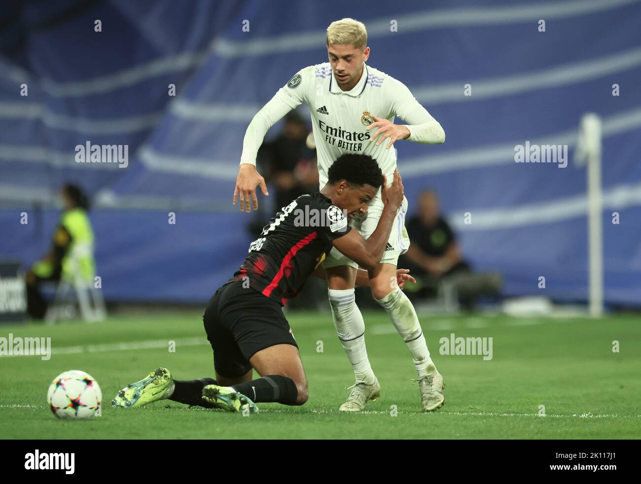 Madrid, Spain. 14th Sep, 2022. Soccer: Champions League, Group Stage, Group F, Matchday 2 Real Madrid - RB Leipzig at Santiago Bernabeu Stadium. Leipzig's Abdou Diallo fights for the ball against Madrid's Federico Valverde. Credit: Jan Woitas/dpa/Alamy Live News Stock Photo