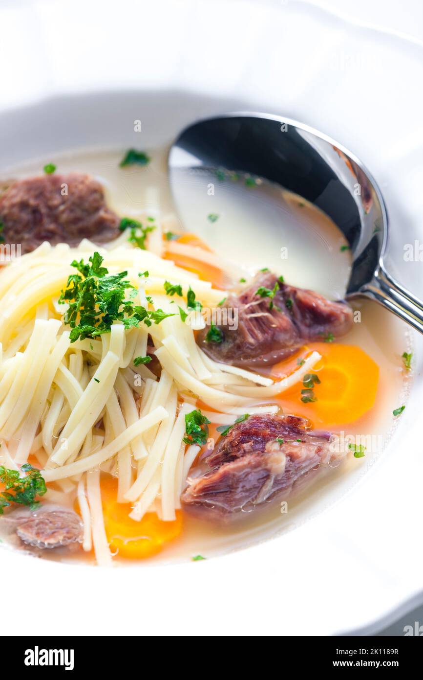 beef broth with noodles and carrot Stock Photo Alamy
