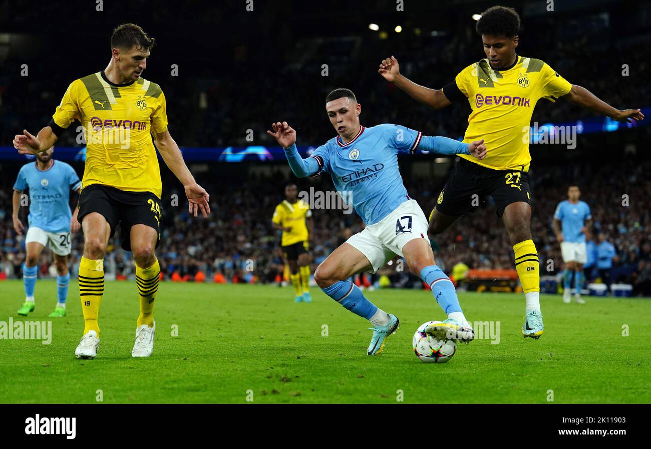 Borussia Dortmund's Thomas Meunier, Manchester City's Phil Foden and Borussia Dortmund's Karim Adeyemi (left-right) battle for the ball during the UEFA Champions League Group G match at the Etihad Stadium, Manchester. Picture date: Wednesday September 14, 2022. Stock Photo