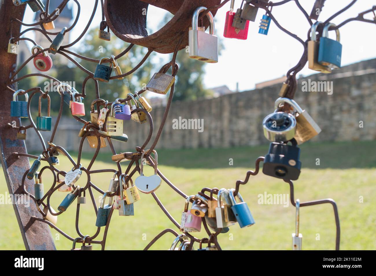 Lockers of love in Bardejov city, Slovakia. Near singing fountain is big metal heart where people can lock their love with lockers. Stock Photo