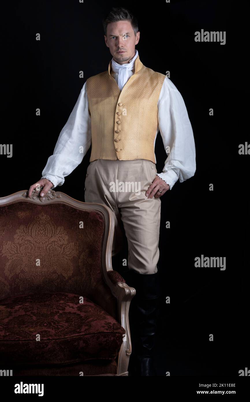 A Regency gentleman wearing a gold waistcoat and breeches Stock Photo -  Alamy