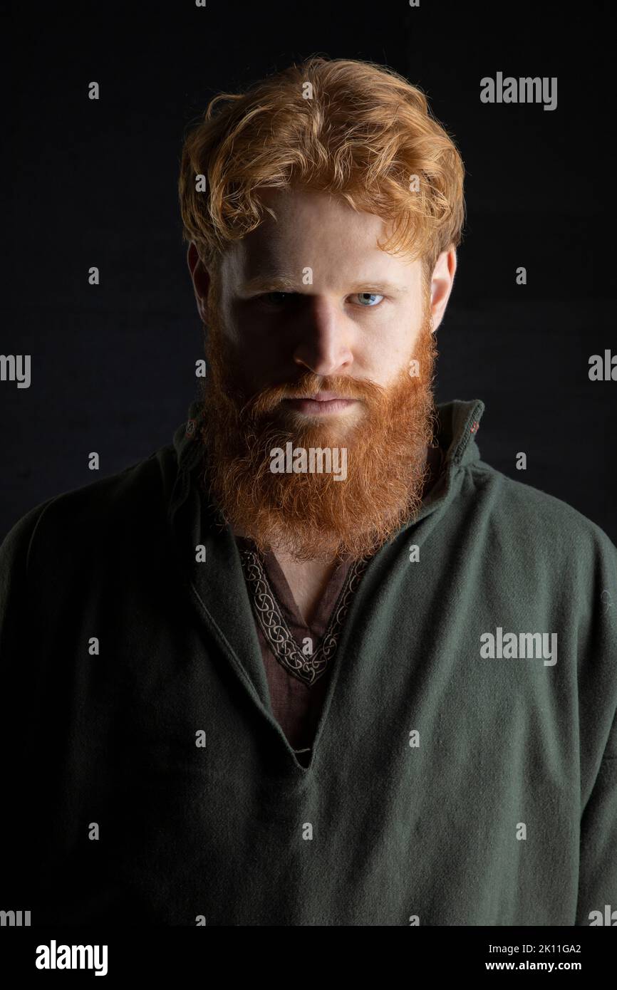 A Viking, dark ages, or high fantasy man with red hair and beard Stock Photo