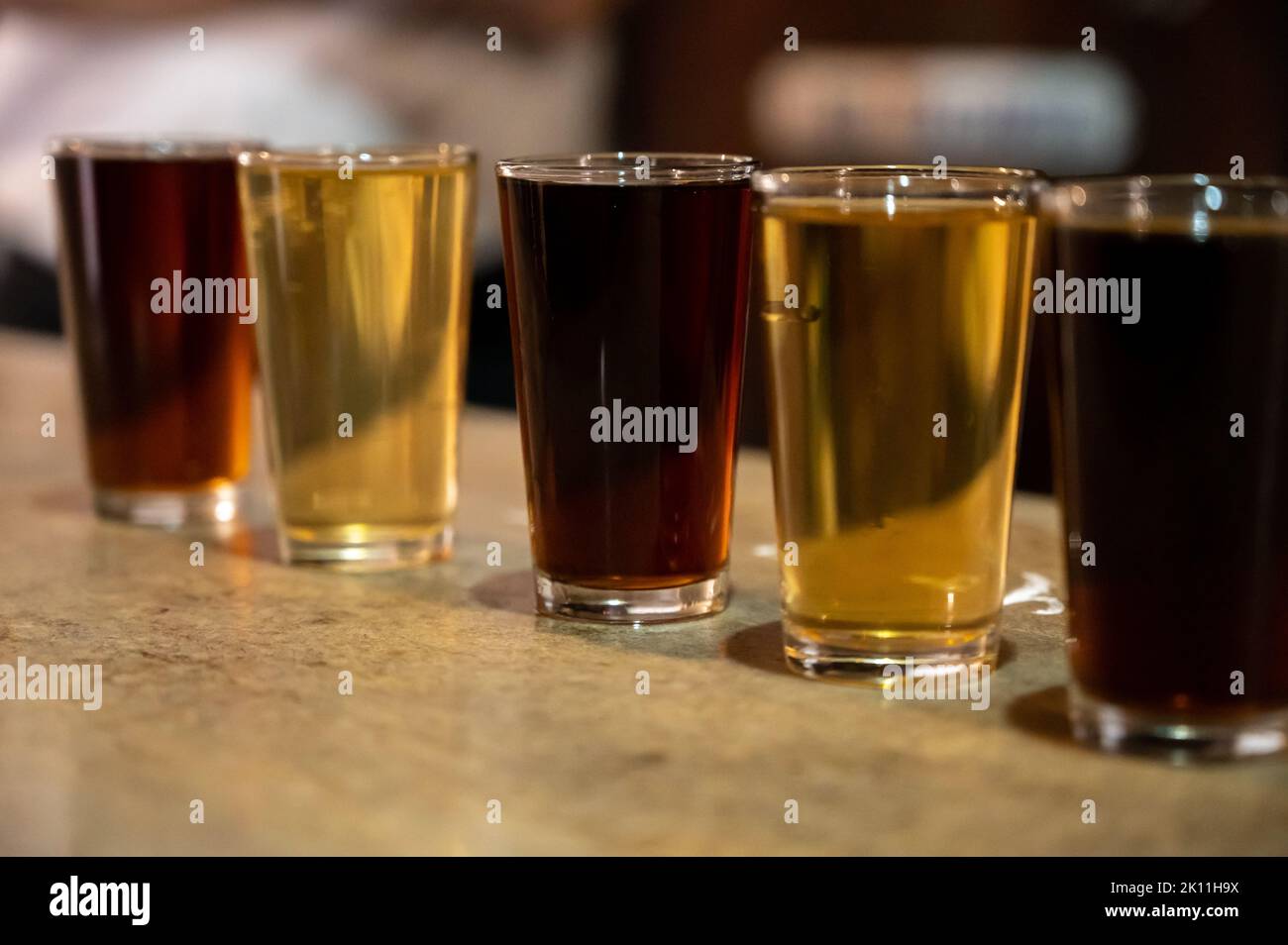 Tasting of different sweet wines from wooden barrels on old bodega wine