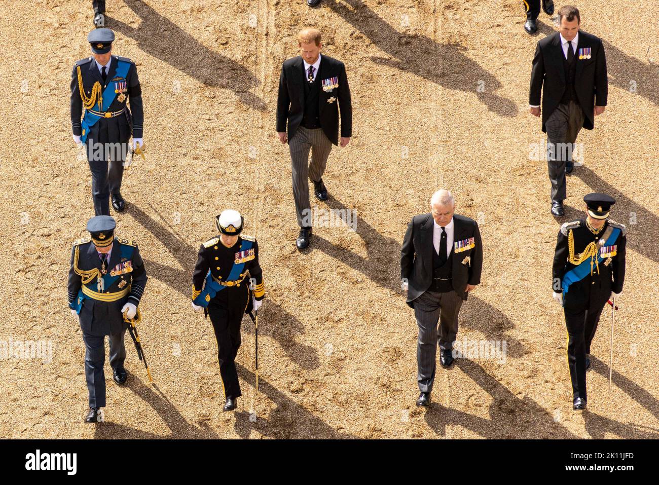 Britain's Prince William, Prince of Wales, Britain's King Charles III, Britain's Prince Harry, Duke of Sussex, Britain's Princess Anne, Princess Royal, and Vice Admiral Timothy Laurence walk behind the coffin of Queen Elizabeth II, during a procession from Buckingham Palace to the Palace of Westminster, in London on Wednesday on September 14, 2022, where the coffin of Queen Elizabeth II, will Lie in State. Queen Elizabeth II will lie in state in Westminster Hall inside the Palace of Westminster, from Wednesday until a few hours before her funeral on Monday, with huge queues expected to file pa Stock Photo