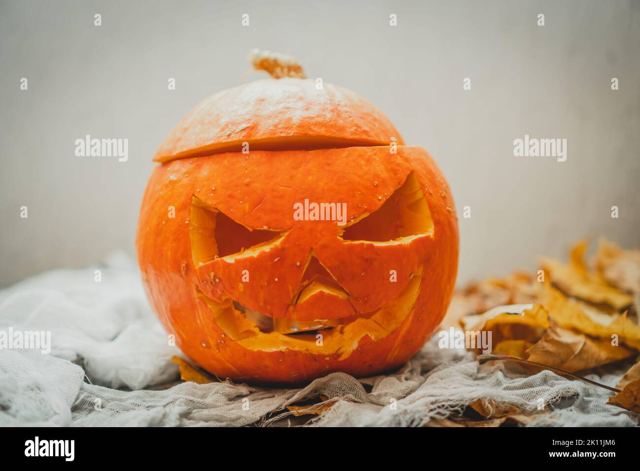 Orange bright halloween pumpkin with carved nose, mouth and eyes on ...