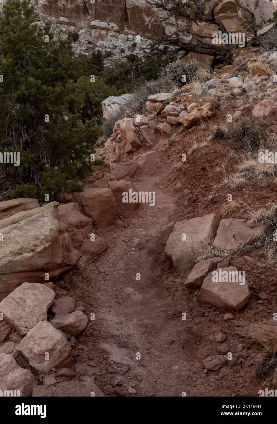 Red Dirt Trail Cuts Around Rocky Cliffside Stock Photo Alamy