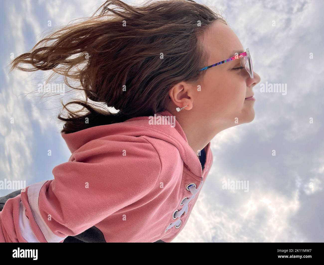 Young teenager girl portrait flying concept Stock Photo